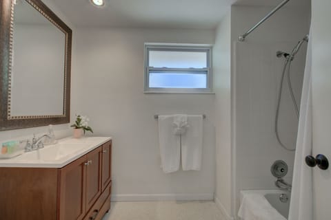 Combined shower/tub, hair dryer, towels, soap