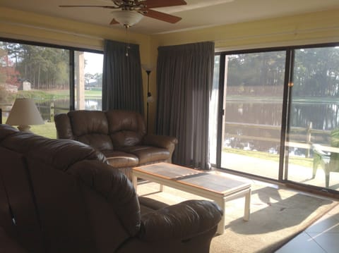 family room with pond view and patio access