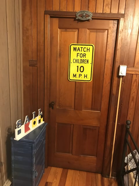 Knotty pine door leading to Crew Room