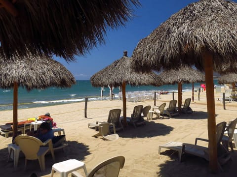 On the beach, sun loungers, beach towels