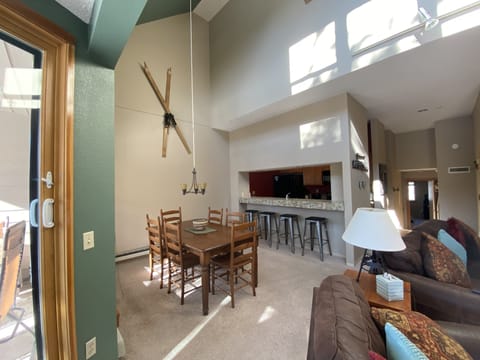 Dining area with bar stools at the counter for extra space.