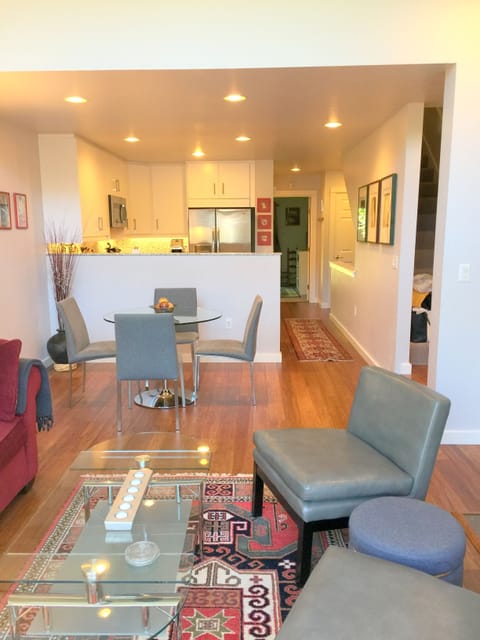 New hardwood bamboo floors flow from living to dining room to kitchen