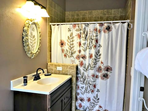 Combined shower/tub, hair dryer, towels, soap