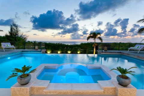 Outdoor pool, an infinity pool, sun loungers