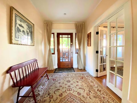 Entryway with French doors that open into the master bedroom.