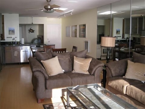 Open floor plan with second bedroom in background.