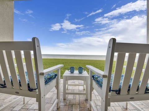 Oceanfront patio that is steps away from the surf. Enjoy the grassy backyard.