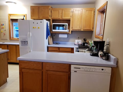 All Equipped Kitchen with Stove, Fridge, Dishwasher for Preparing Your Meals