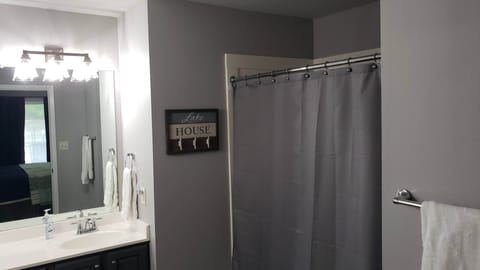 Combined shower/tub, hair dryer, towels, soap