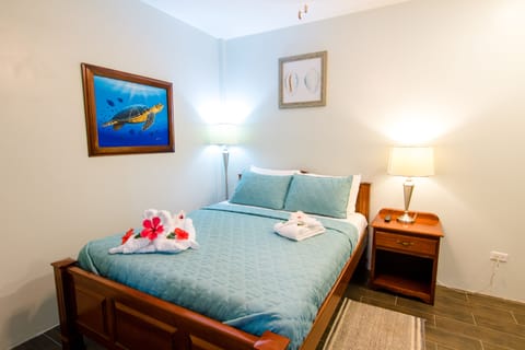 Bedroom with Queen-bed, TV, Air Conditioner and Safe