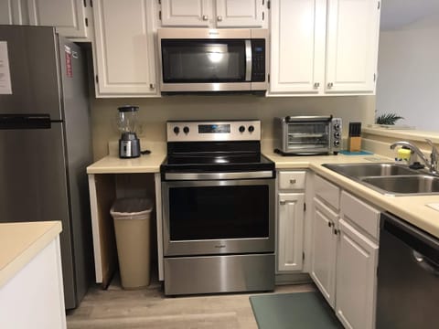 fully stocked kitchen with all new stainless steel appliances