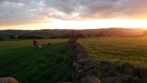 sunset over the fields behind the cottage