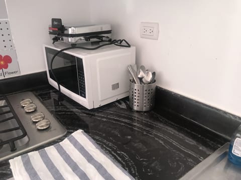 Microwave, coffee/tea maker, cookware/dishes/utensils