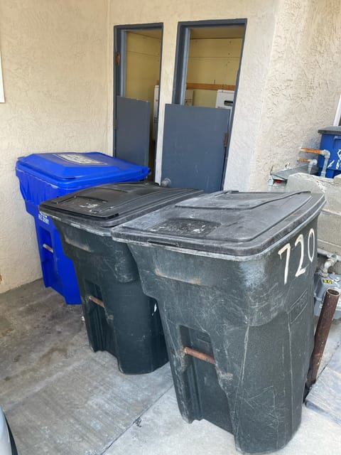 Garbage can area behind outdoor parking spot are shared with the upstairs unit.
