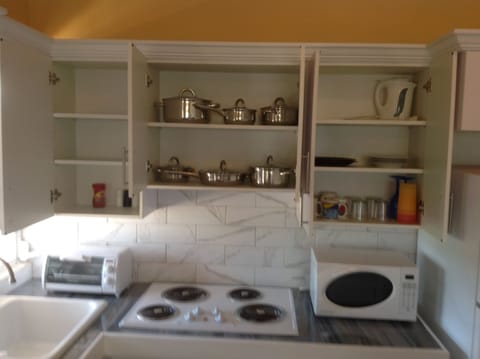 Fridge, microwave, stovetop, coffee/tea maker