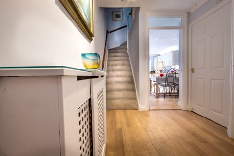 The welcoming hallway leading to the kitchen and family room.