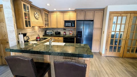 BC West Condo A-2 kitchen with breakfast bar