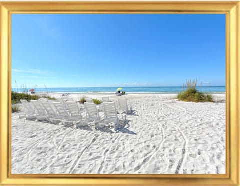 On the beach, sun loungers, beach towels