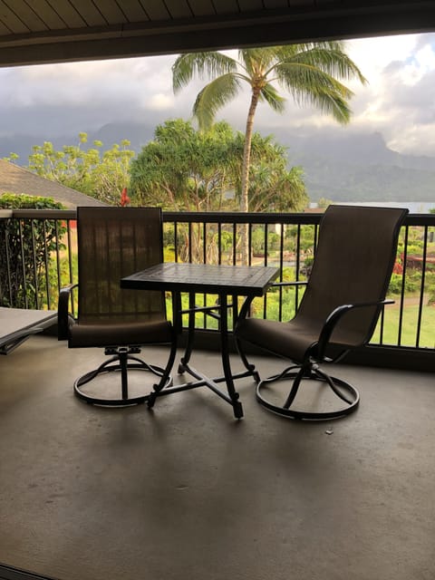 Lanai with view of Hanalei Bay, Lagoon Pool and waterfall mountains.