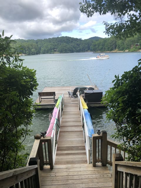 Dock with 4 Kayaks and jet ski whips on the right. Dock  20 x 20 with 25ft ramp