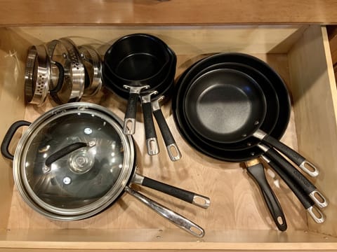Pots, pans and lids. Not pictured: mixing bowls, measuring cup, strainer, grater