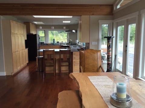 Lg Canadian Maple custom dinner table~in front of window. Open concept kitchen