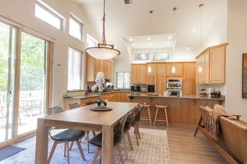 Dining room and kitchen. Dining table extends to easily fit 10.