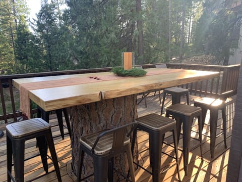 Pine table seats up to 10 on back patio