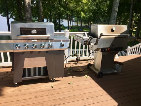 Two gas grills on the deck