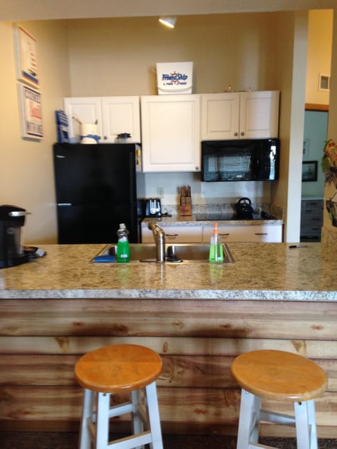 Remodeled kitchen with 2 counter stools