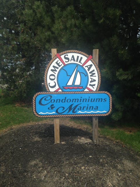 Condo entrance sign by the pool