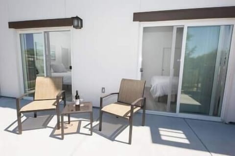 Private patio accessible from both bedrooms, with views of olive trees and occasional turkeys.