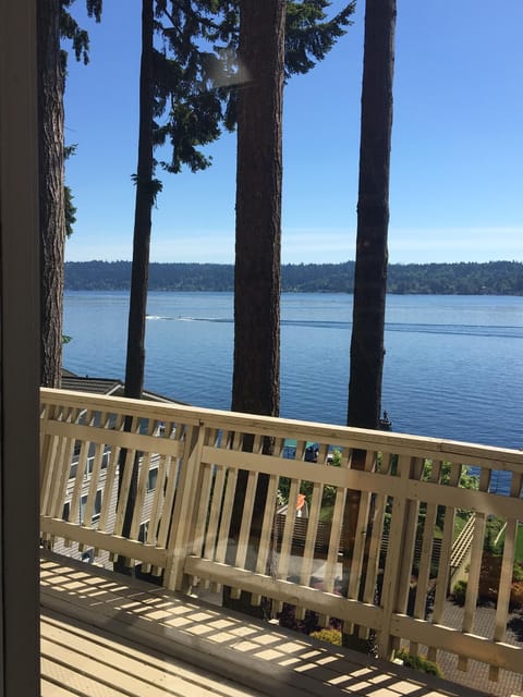 Deck runs full length of house, waterfront access at end of driveway