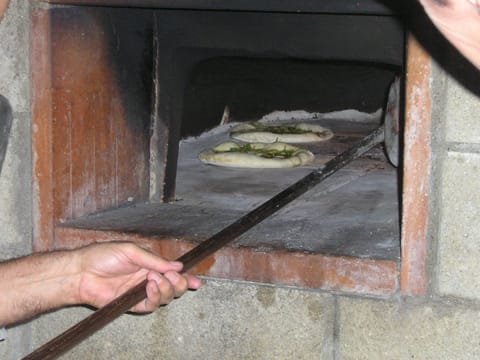 focaccia baking in the brick oven