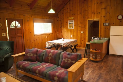 Entrance, dining area, and door to bedroom.