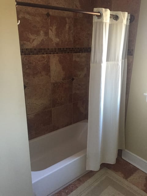 Combined shower/tub, hair dryer, towels, soap