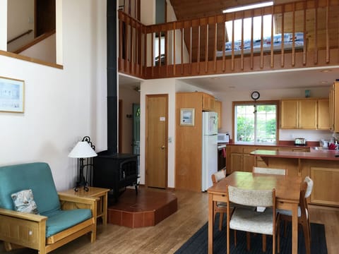 The upstairs loft area has a queen size futon.  Wood stove below.