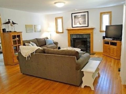 Family room with 42 inch flat screen tv and all new furniture and fireplace