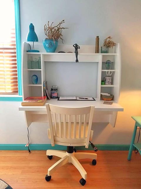 Wall mounted desk in living area 