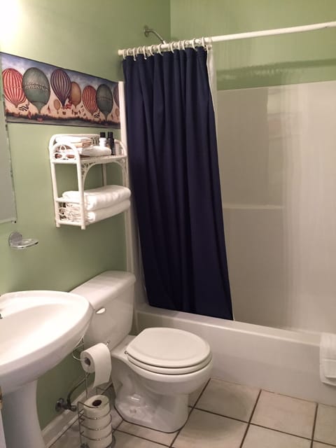Front bathroom with tub/shower combo.