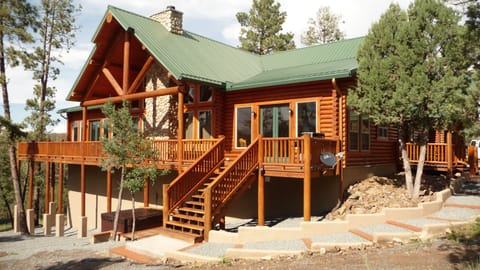 Beautiful side view of the Chalet style log home.