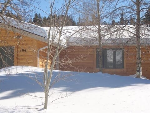 front of the house, lots of trees and plenty of parking