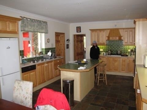 Kitchen which leads to the family room and living room