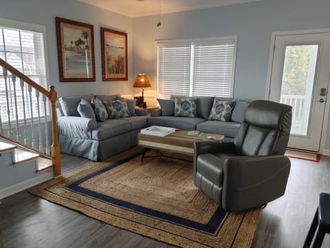 Spacious living room with sofa, loveseat and recliner.  