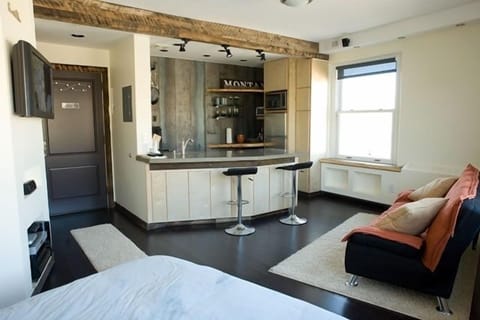 Kitchen, bar, NE window and sleeper sofa
