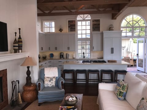 Spacious living area with flat screen TV and wood burning fireplace!