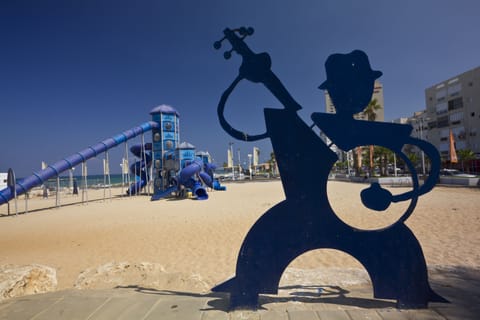 On the beach, sun loungers, beach towels