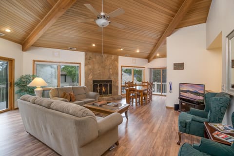 A vaulted ceiling and golf course views give the family room a very open feel