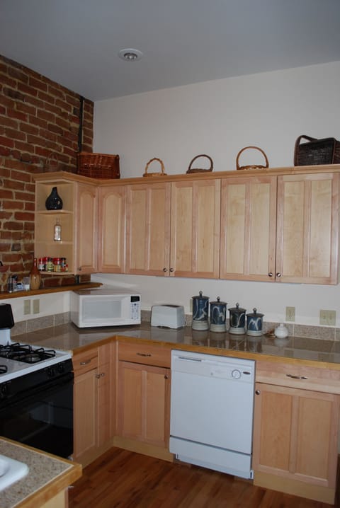 Kitchen is well equipped for preparing and serving meals at home.