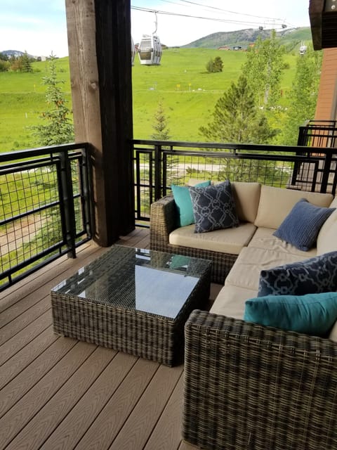 Large deck with mountain and gondola views. Perfect place to enjoy your coffee!